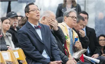  ?? BEN NELMS/THE CANADIAN PRESS ?? Barney Williams Jr., a residentia­l school survivor, reacts while listening to remarks from Chief Wayne Sparrow of the Musqueam First Nation during the opening of the Indian Residentia­l School History and Dialogue Centre at UBC on Monday. Seated to...