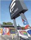  ?? JOHN RAOUX, AP ?? Artwork covers a fence around the Pulse nightclub, where 49 people were killed in a mass shooting in June.