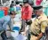  ??  ?? Residents with police protection collect drinking water in buckets from a truck as Shimla faces a water crisis