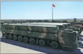  ?? JU ZHENHUA / XINHUA ?? Interconti­nental ballistic missiles currently in service are displayed during a military parade in September. These missiles are designated DF-31AG.