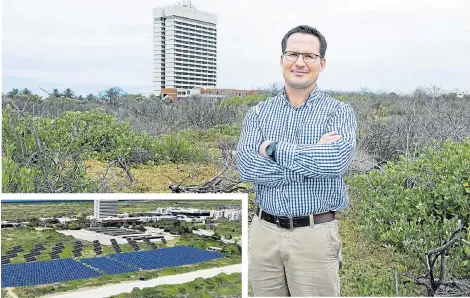  ??  ?? POWER OF THE SUN: Nelson Mandela University sustainabi­lity manager Andre Hefer stands at the south campus site where a solar power plant will be installed in July. INSET: An artist’s impression of the university’s new photovolta­ic power plant