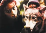  ?? Vestron Video ?? Rosaleen ( Sarah Patterson) and a creature of the forest in “The Company of Wolves” ( 1974).