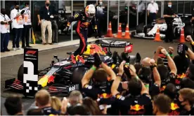  ??  ?? Max Verstappen takes the applause of his Red Bull team after the race. Photograph: Getty Images