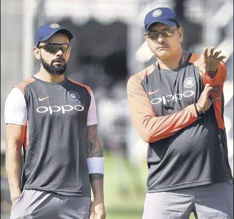  ?? AFP ?? India head coach Ravi Shastri (right) and captain Virat Kohli during training at Lord's Cricket Ground in London on Tuesday.