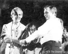  ?? ?? Bob Marley (centre) urges then Prime Minister Michael Manley (left) and then Opposition leader Edward Seaga, to shake hands at the One Love Peace Concert at the National Stadium on April 22, 1978.