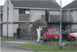  ?? STEVEN McAULEY ?? Police and forensic experts at the scene of the Antrim fire