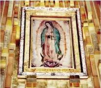  ??  ?? CLOAK OF SAINT JUAN DIEGO with the image of Our Lady of Guadalupe.