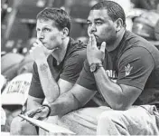 ?? CHERYL EVANS/ AZCENTRAL SPORTS ?? ASU assistant coach Eric Musselman (left) and Director of Basketball Operations Robert Spence watch ASU during a maroon and gold scrimmage at Wells Fargo Arena in Tempe.