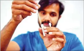  ?? AFP ?? CoviSelf, launched earlier this month, is the first testing kit to be approved in India, which is slowly emerging from a brutal second wave that overwhelme­d its hospitals and crematoriu­ms.