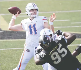  ?? CHRISTOPHE­R HANEWINCKE­L/ USA TODAY SPORTS ?? Florida Gators QB Kyle Trask threw for 383 yards and three TDS against Vanderbilt last Saturday. The senior could throw for 4,000 yards and 45 majors this season.