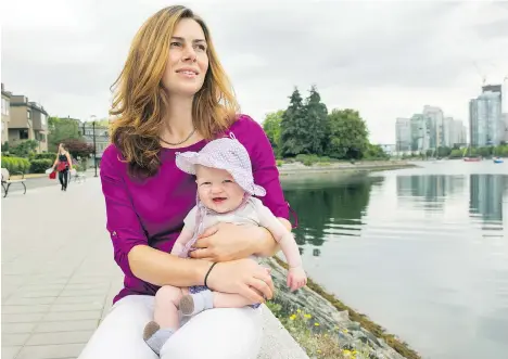  ?? ARLEN REDEKOP ?? Jessica Pautsch Regan, with three-month-old daughter Davina at False Creek, has set up FoodMesh, a program that delivers food that would otherwise be wasted to charities and businesses. “Ideally, you’d like a target of zero food waste,” Regan says.