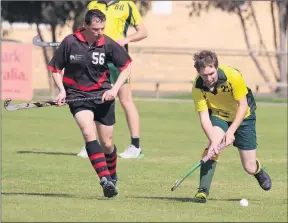  ??  ?? HOCKEY ACTION: Paul Mackereth of Horsham Hurricanes, left, and Brett Tischler, Dimboola Burras, at the weekend. Picture: SIMON KING