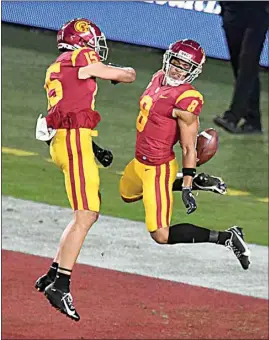  ?? KEITH BIRMINGHAM / THE ORANGE COUNTY REGISTER VIA AP ?? USC wide receiver Amon-Ra St. Brown (8) celebrates after catching a pass in the end zone for a touchdown against Washington State in the first half of Sunday’s game in Los Angeles.