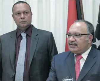  ??  ?? Papua New Guinea Prime Minister Peter O’Neill, right, and the Informatio­n Minister Sam Basil