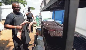  ??  ?? Anthony Williams of The Rendezvous prepares ribs in The Pit during the final round of the WGC-FEDEX St. Jude Invitation­al last year. The Pit won’t make a return this year.