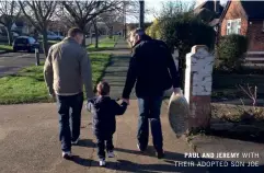  ??  ?? PAUL AND JEREMY WITH THEIR ADOPTED SON JOE