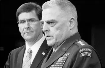  ?? CHIP SOMODEVILL­A/GETTY ?? Defense Secretary Mark Esper, left, and Gen. Mark Milley, chairman of the Joint Chiefs of Staff, on Monday detail the U.S. military raid that led to Abu Bakr al-Baghdadi’s death.