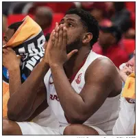  ?? NWA Democrat-Gazette/BEN GOFF ?? Arkansas senior Trey Thompson watches from the bench during the closing minutes of Friday’s season-ending loss to Butler.