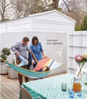  ??  ?? The dining room opens out onto a deck made of Siberian larch wood on the south-facing side of the house (below) – a favourite spot for an al fresco dinner on balmy summer evenings. On hot days, the pin oaks on the pavement provide much-needed shade....