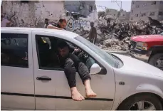  ?? Bloomberg ?? An injured Palestinia­n man is driven to hospital after an Israeli air strike in Bureij, central Gaza