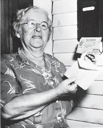  ?? THE ASSOCIATED PRESS ?? Ida May Fuller, shown at her Vermont home in October 1950, displays the nation’s first Social Security check, which she received in January 1940.