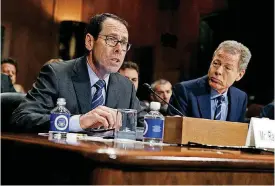  ?? [AP FILE PHOTOS] ?? In this 2016 file photo, AT&T Chairman and CEO Randall Stephenson, left, testifies on Capitol Hill in Washington, before a Senate Judiciary subcommitt­ee hearing on the proposed merger between AT&T and Time Warner, as Time Warner Chairman and CEO...