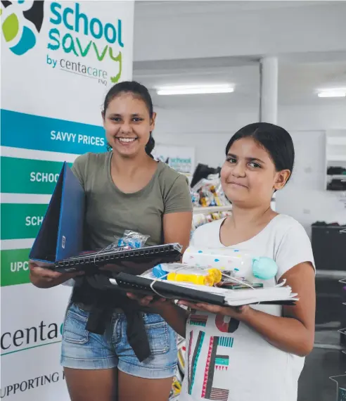  ?? Picture: STEWART McLEAN ?? GET READY: Centacare FNQ has opened the second annual School Savvy Pop-up Shop. Sisters Lillian, 12, and Isabella Savage, 9, with some of their school supplies.