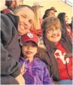  ?? ?? OU fan Sarah Miller, right, watches the 2017 OU-West Virginia game with her son and granddaugh­ter, Gerald and Tessa Miller.