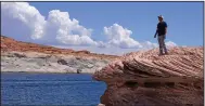  ?? (AP/Rick Bowmer) ?? Bill Schneider stands near Antelope Point’s public launch ramp on Lake Powell on July 31, 2021, near Page, Ariz.