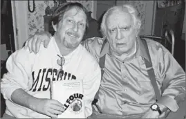 ?? CHICAGO TRIBUNE ?? Tribune baseball writer Paul Sullivan, left, poses with former Tribune baseball writer Jerome Holtzman in 2007 after Holtzman gave him his autographe­d copy of “Ball Four.”