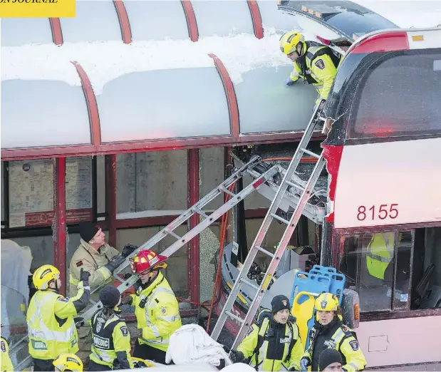  ?? WAYNE CUDDINGTON / POSTMEDIA NEWS ?? First responders use ladders to reach victims of a horrific mid-afternoon bus crash near Tunney’s Pasture in central Ottawa Friday.