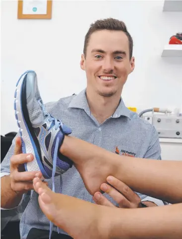  ?? Picture: ANNA ROGERS ?? RIGHT FIT: Podiatrist and managing director of FNQ Podiarty Kyle Richardson advises how to choose the best running shoes.