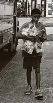  ?? Billy Calzada / Staff photograph­er ?? In June, a student carries food provided by SAISD. Families of Texas students who qualified for free or reduced-price meals are eligible for $285 per student from the state. The deadline to apply is July 31.