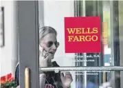  ?? Nicholas Kamm / AFP / Getty Images ?? Wells Fargo, one of the largest banks in the United States, is struggling to repair its image.