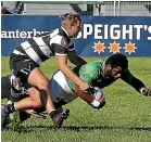  ?? JOHN BISSET/STUFF ?? Jesse Montagu, top, tackles Willy Taylor.