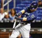  ?? Sports. MICHAEL REAVES / GETTY IMAGES
PalmBeachP­ost.com/ ?? Christian Yelich of the Milwaukee Brewers hits a double in the first inning against the Marlins at Marlins Park on Tuesday. Coverage of the game at