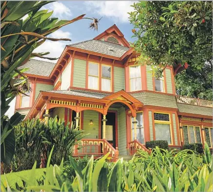  ?? Mark Boster For The Times ?? ROWS OF COLORFUL, historic homes are within walking distance of the bustling Village in the “city of trees and PhDs.”