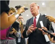  ?? PHOTO BY TOM BRENNER/THE NEW YORK TIMES ?? Sen. Lamar Alexander, R-Tenn., speaks to reporters Thursday at the Capitol in Washington.