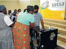  ?? /Sowetan ?? Collection day: Pensioners collect their grant money in Mpumalanga. Sassa wants CPS to continue dispensing cash payments to social-grant beneficiar­ies.