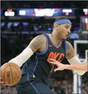  ?? BILL KOSTROUN — THE ASSOCIATED PRESS ?? Oklahoma City Thunder forward Carmelo Anthony drive against the New York Knicks during the second quarter Saturday.