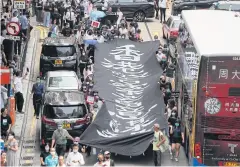  ?? REUTERS ?? People march to protest against what they say is the abuse of pro-democracy protesters by Hong Kong police, yesterday.