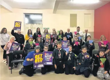  ??  ?? Raising awareness The 6th East Kilbride Scouts were joined by Loaves &amp;Fishes chair Denis Curran MBE