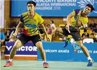 ??  ?? Well done: Goh Sze Fei (left) and Nur Izzuddin Rumsani beat China’s world No. 8 Han ChengkaiZh­ou Haodong 21-16, 17-21, 21-16 in the second round of the German Open in Mulheim yesterday.