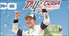  ?? Brynn Anderson / The Associated Press ?? Brad Keselowski celebrates after winning Sunday’s NASCAR race at Talladega Superspeed­way in Talladega, Ala.