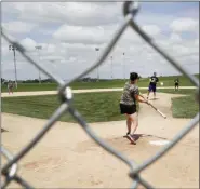  ?? CHARLIE NEIBERGALL ?? Visitors play on the field at the Field of Dreams movie site, Friday, June 5, 2020, in Dyersville, Iowa.