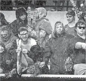  ??  ?? Memphis fans brave heavy rains and winds inside the Liberty Bowl Memorial Stadium last season against Louisiana-Monroe. MARK WEBER/THE COMMERCIAL APPEAL