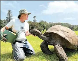  ?? KEVIN GEPFORD / WASINGTON POST ?? Joe Hollins with Jonathan on St. Helena Island in 2022.