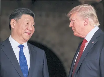  ?? REUTERS ?? US President Donald Trump, right, welcomes Chinese President Xi Jinping in Florida in April last year.