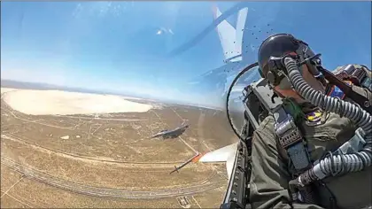  ?? U.S. AIR FORCE VIA AP ?? This image from remote video released by the U.S. Air Force shows Air Force Secretary Frank Kendall during his experiment­al flight inside the cockpit of a X-62A VISTA aircraft autonomous warplane on Thursday above Edwards Air Force Base. The AI-controlled flight is serving as a public statement of confidence in the future role of AI in air combat.