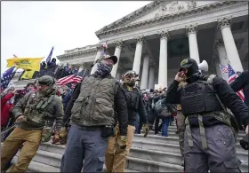  ?? (AP/Manuel Balce Ceneta) ?? Members of the Oath Keepers stand on the East Front of the U.S. Capitol on Jan. 6, 2021.